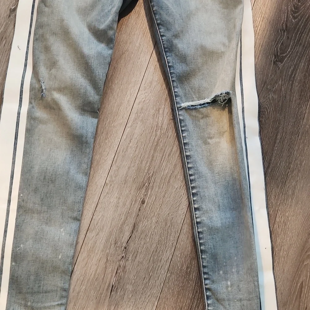 AMIRI Blue and White Skinny Jeans with Distressed Details